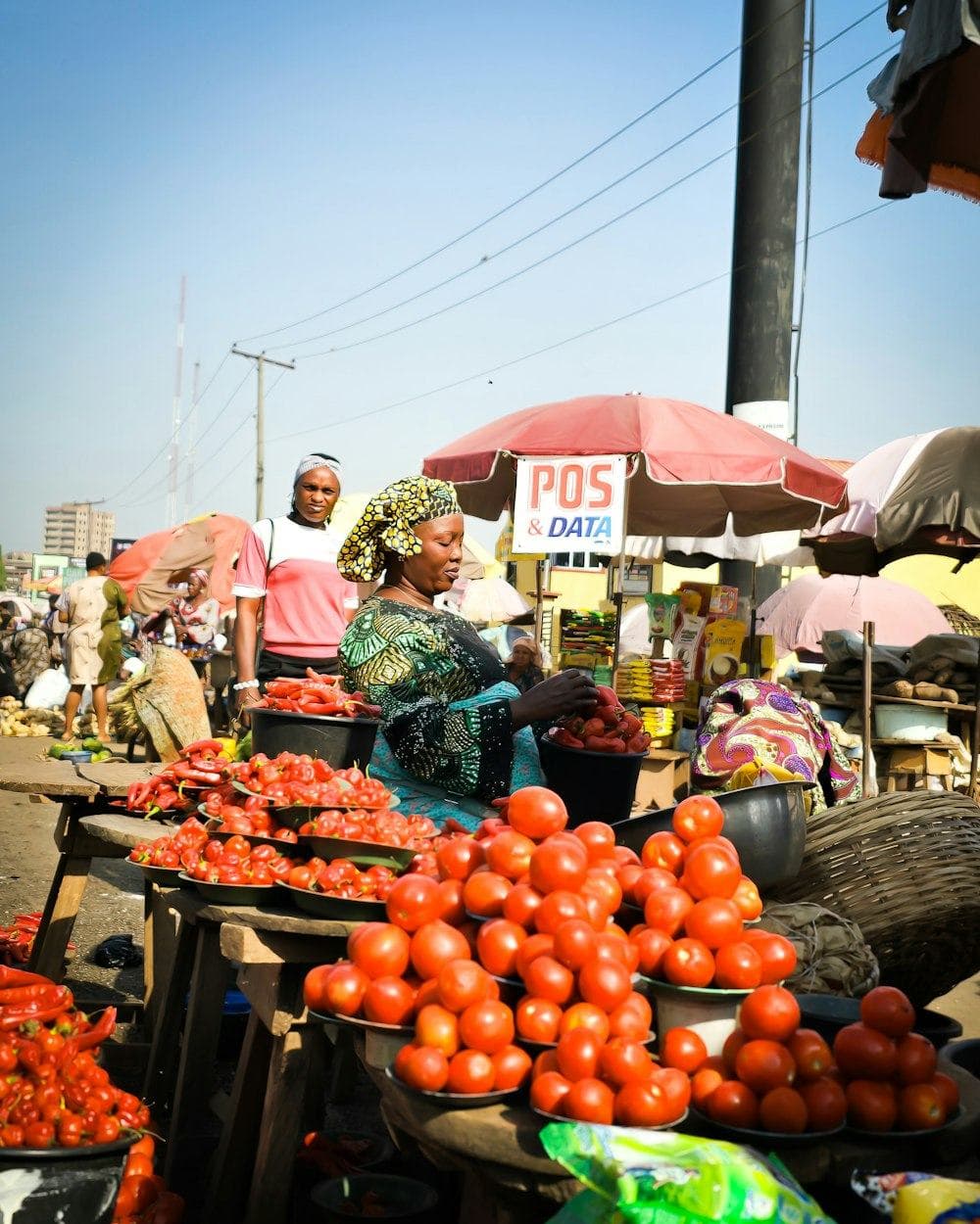 A market stall piled with tomatoes